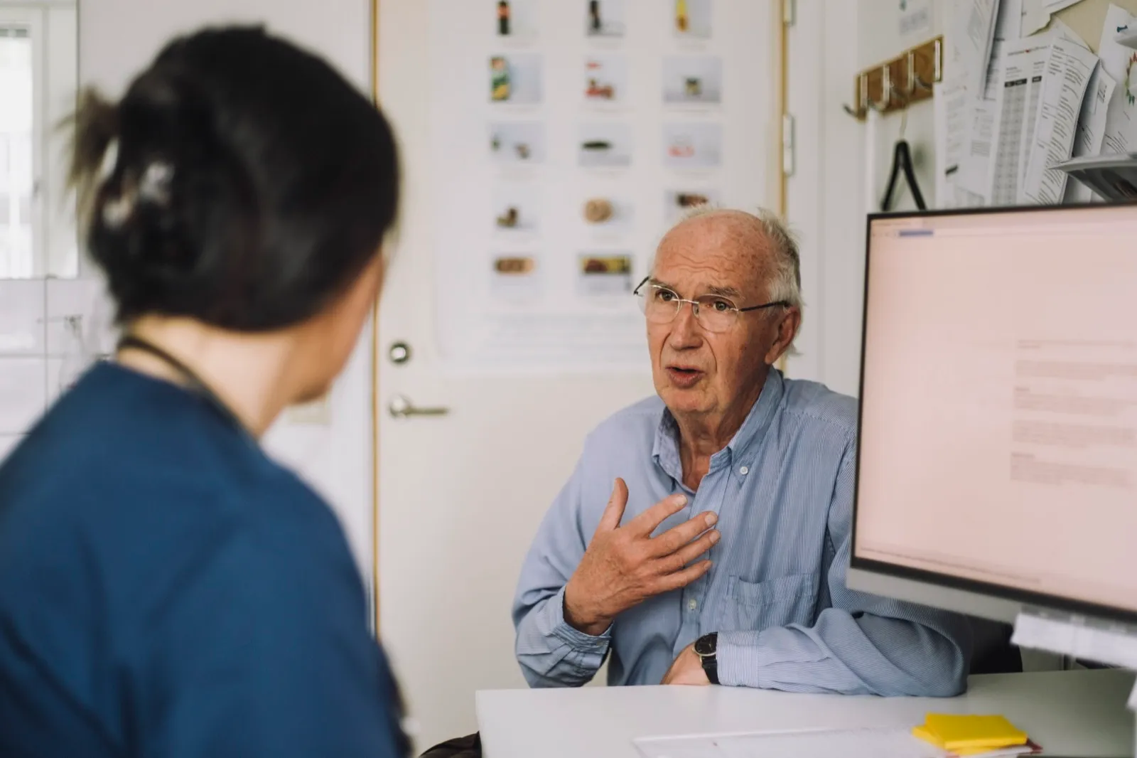 Older man discussing his test result with a healthcare professional